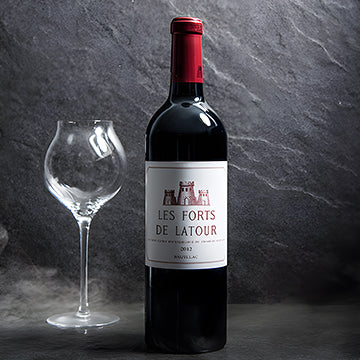 Les Forts de Latour a Grand Cru wine bottle with a glass 13C Jordan Amman
